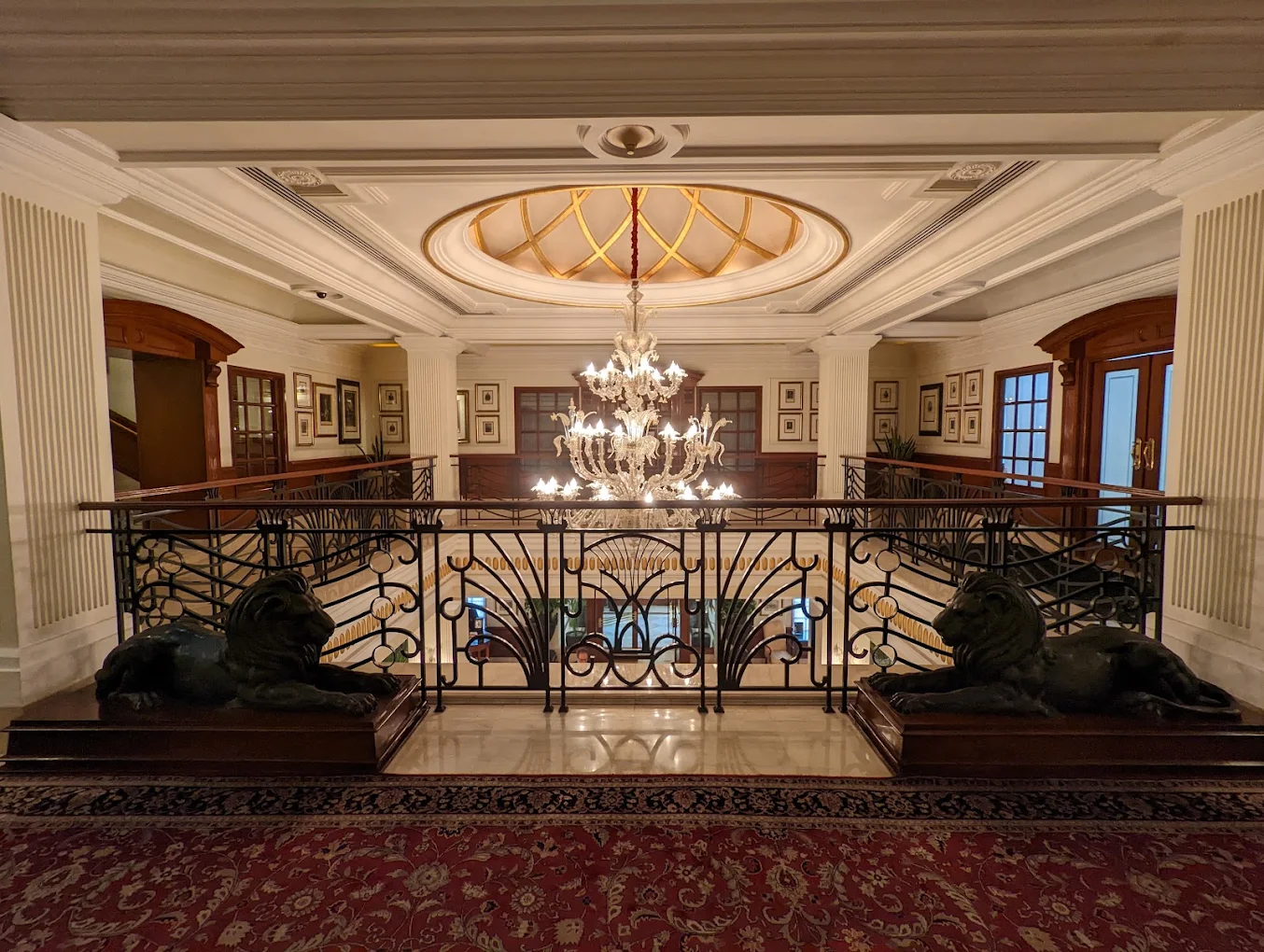 Chandelier, marble landing and framed artwork from the heritage art collection at The Imperial, New Delhi